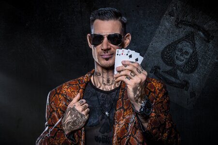 Man gambler playing cards