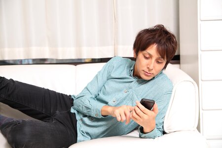 Man sofa smartphone