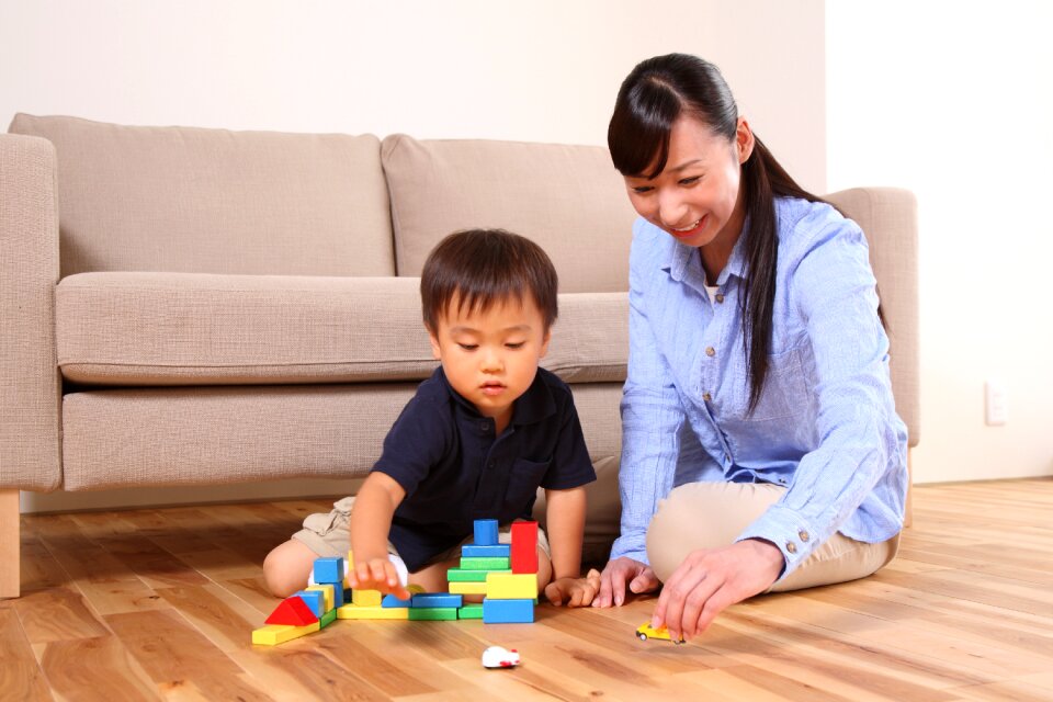 Mother son playing toy block