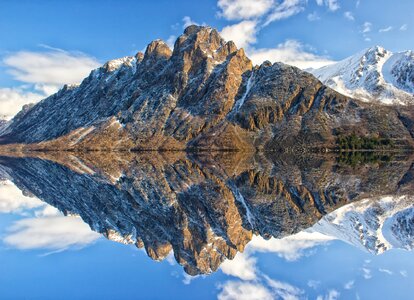 Mountain mirroring sea