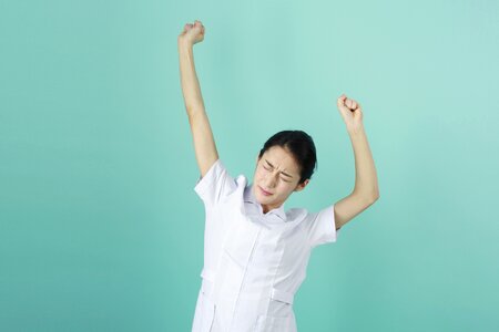 Nurse woman stretching photo