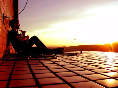 Sunset man playing guitar
