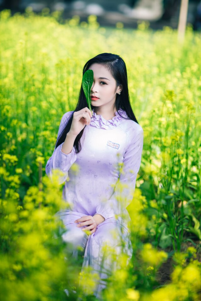 Woman girl canola flower