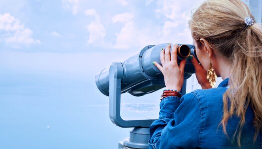 Woman binoculars photo