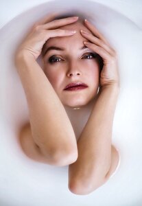 Woman girl milk bathing photo