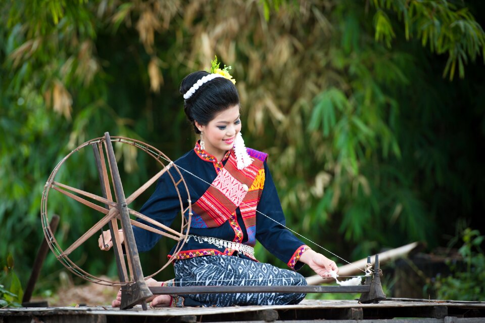 Woman girl spinning wheel