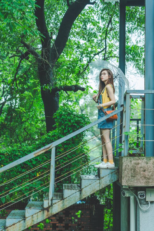 Woman girl umbrella stairs