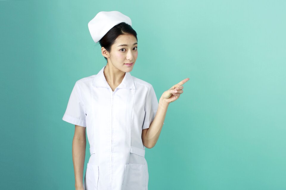 Woman nurse pointing finger