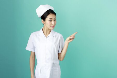 Woman nurse pointing finger