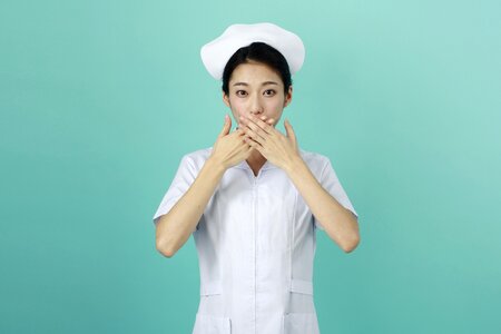 Woman nurse cover mouth