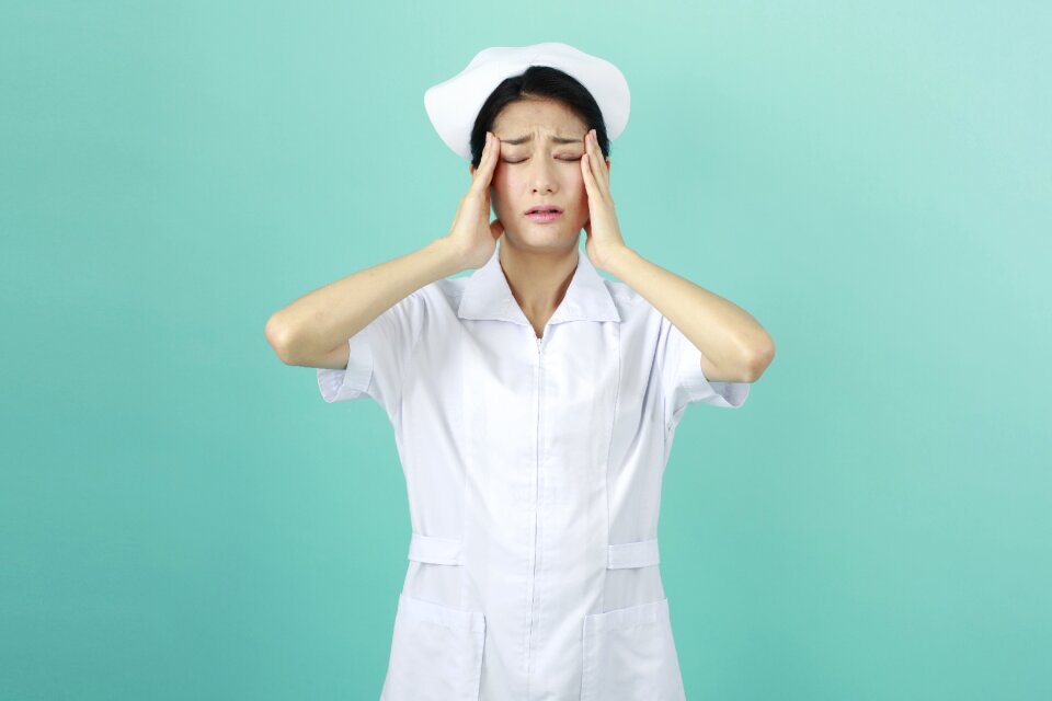 Woman nurse headache