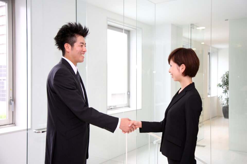 Businessman businesswoman handshake