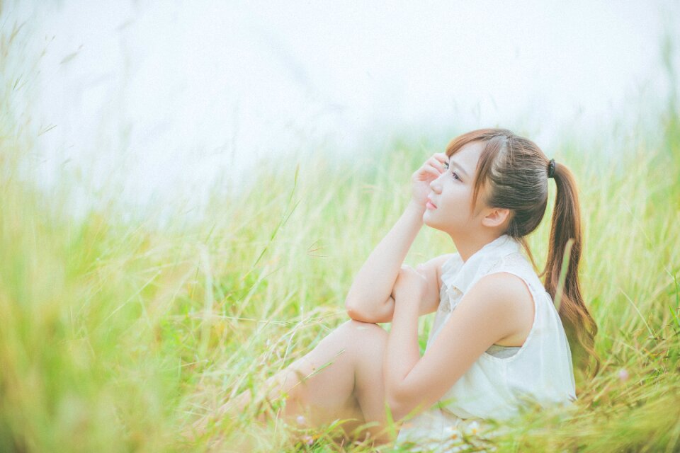 Woman girl portrait grass photo