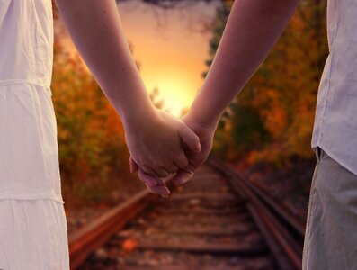 Couple holding hands