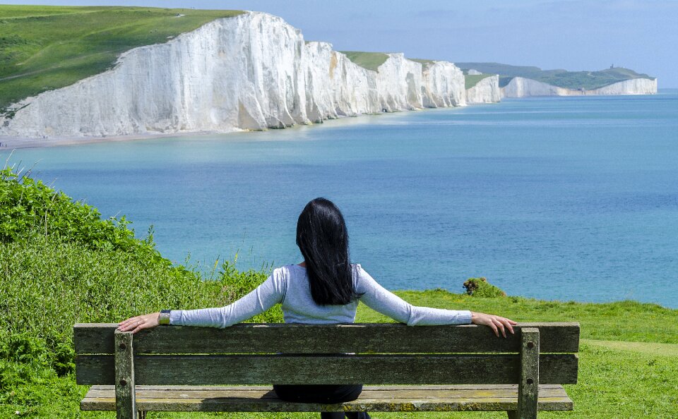Bench woman coast sea