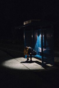 Bus stop woman night