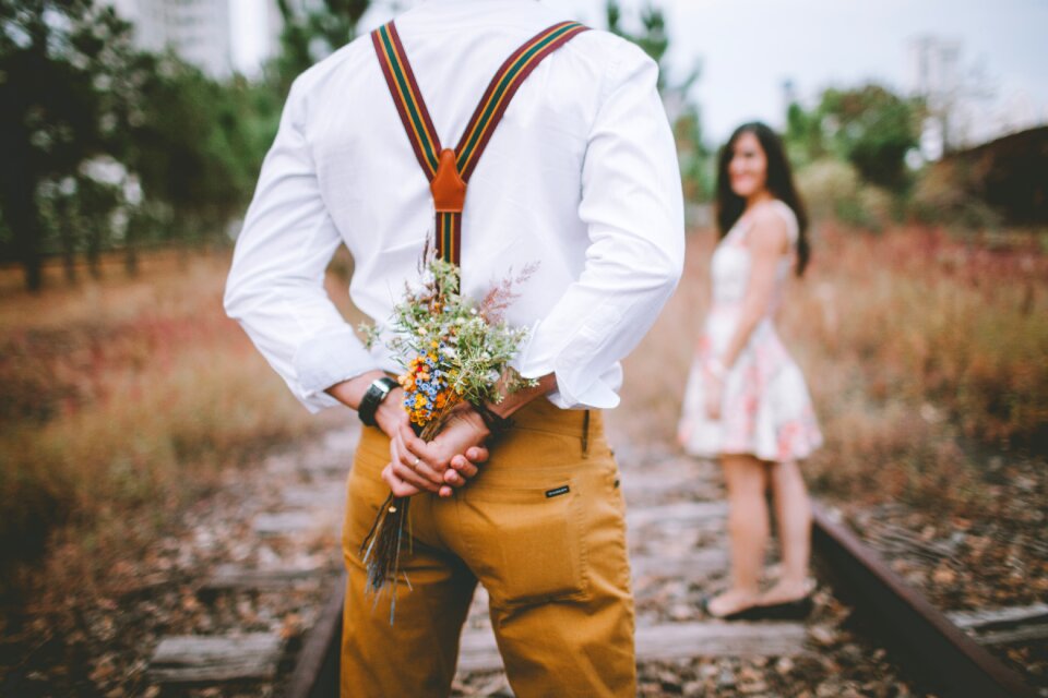 Couple present bouquet