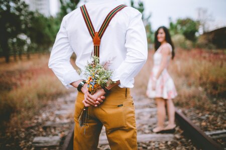Couple present bouquet