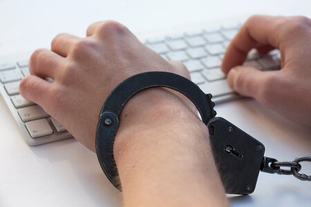 Handcuff hands keyboard