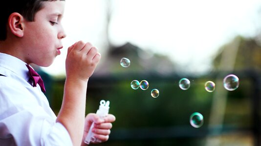 Little boy soap bubbles photo