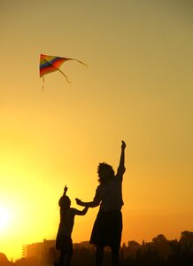 Kite mother son sunset