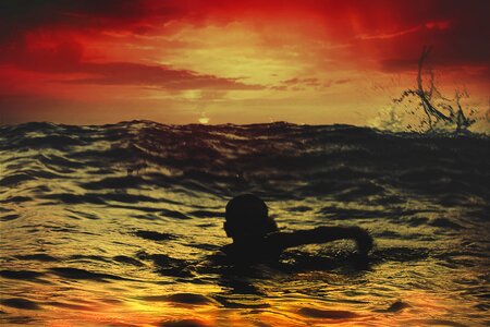 Sunset sea swimming photo
