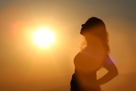 Sunset woman silhouette photo
