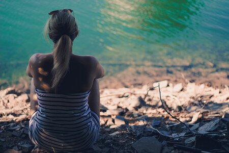 Sitting woman lake
