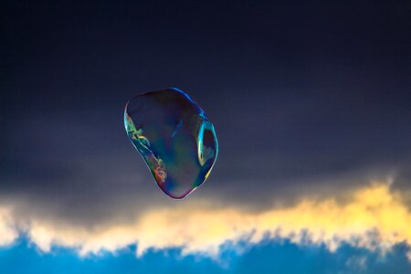 Soap bubble dark clouds photo