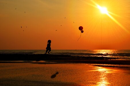 Sunset beach girl balloon photo