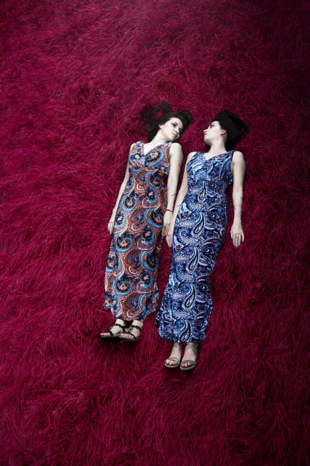 Twins sisters women laying