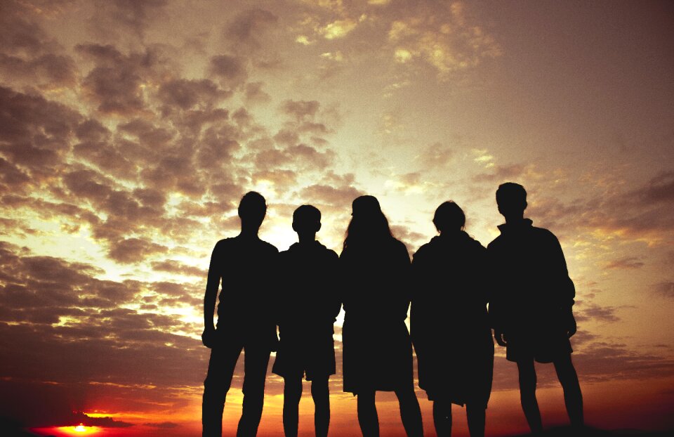 Sunset five people silhouette