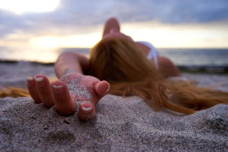Woman beach laying photo