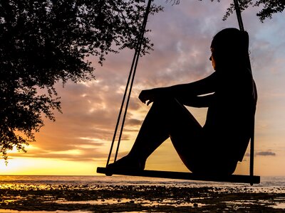 Woman girl swing sunset