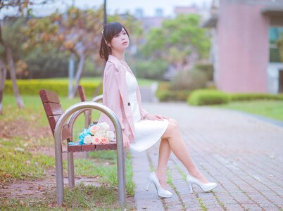 Woman girl sitting bench photo