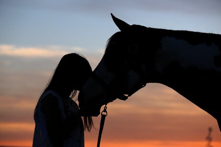 Woman horse kiss photo