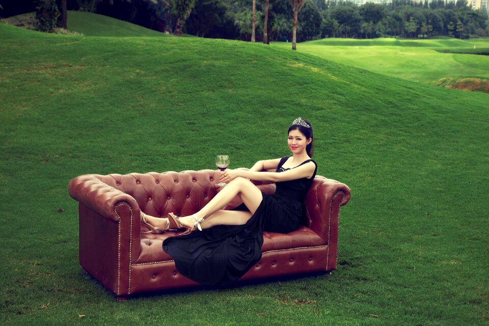 Woman sitting sofa wine