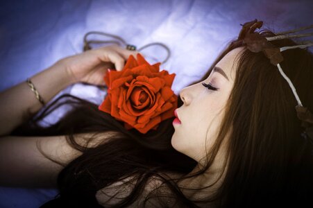 Woman girl sleeping rose photo