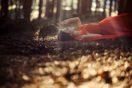Woman girl laying forest photo