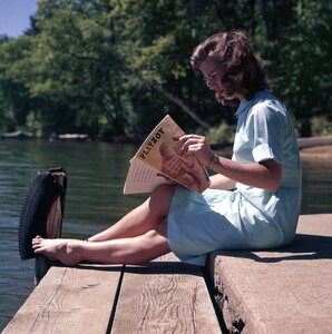 Woman reading magazine photo