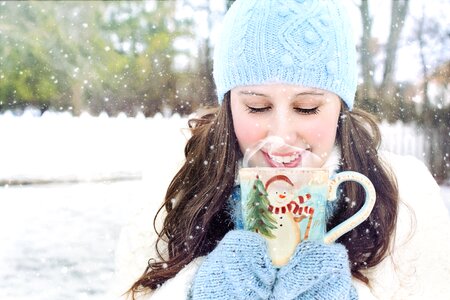 Woman snow mug photo