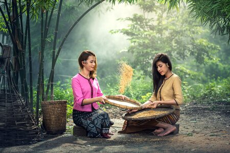 Women threshing farmer