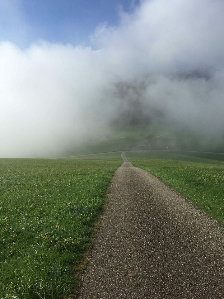 Clouds dirt road fog