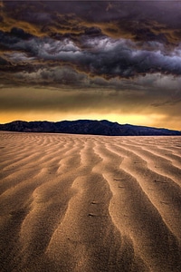 Clouds desert dune photo