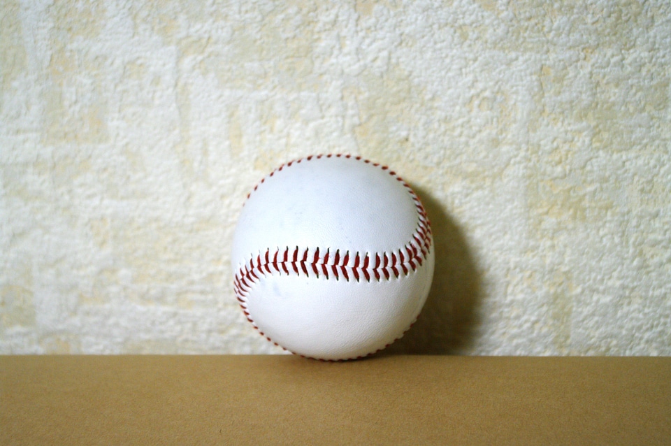 4 A ball used in playing baseball