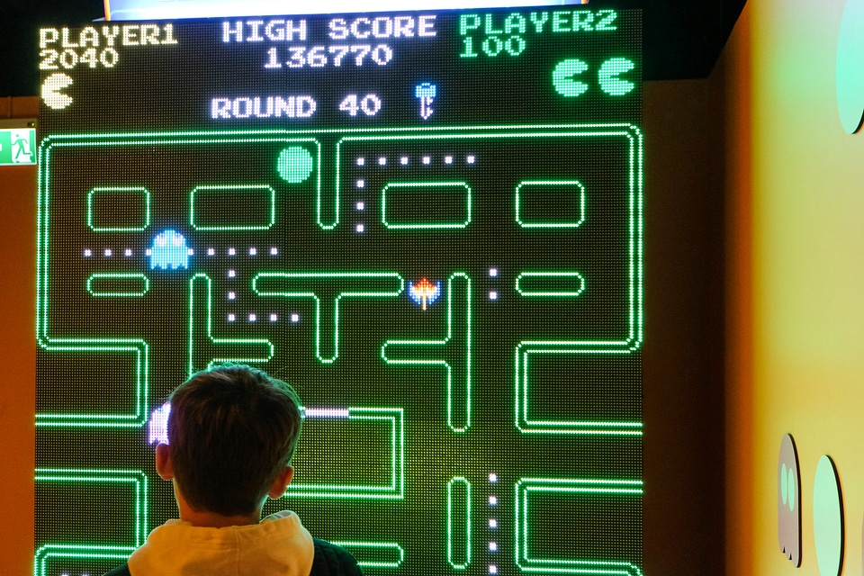 Kid Playing PAC-MAN