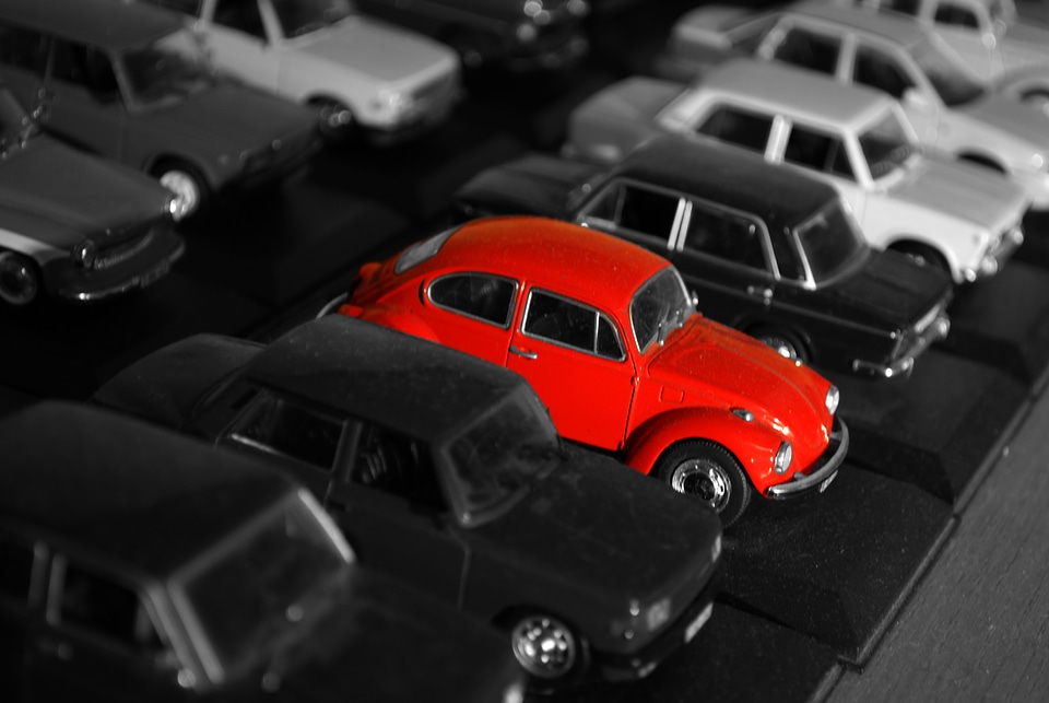 Red Collectible Toy Model Car Volkswagen Beetle on a Black and White Background