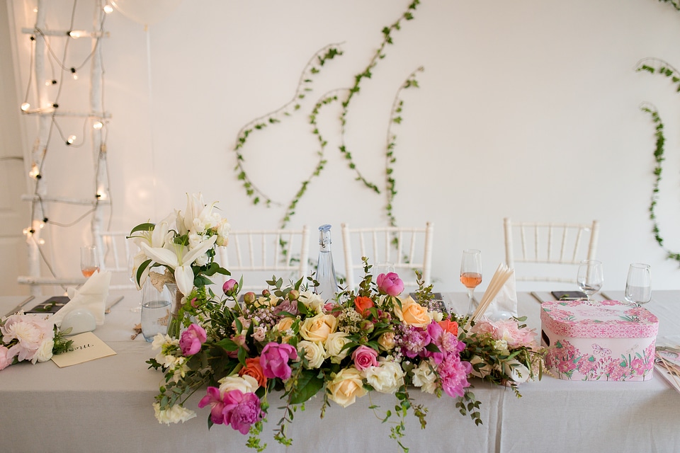 Bride and Groom Table Decorated with Flowers