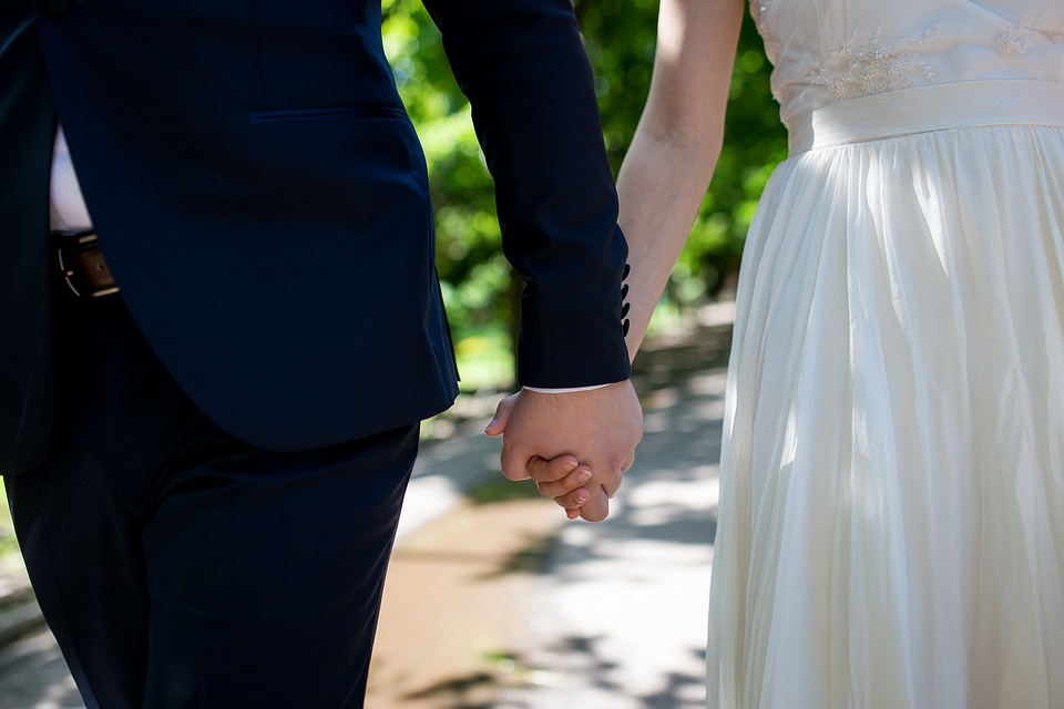 Bride and Groom Holding Hands photo