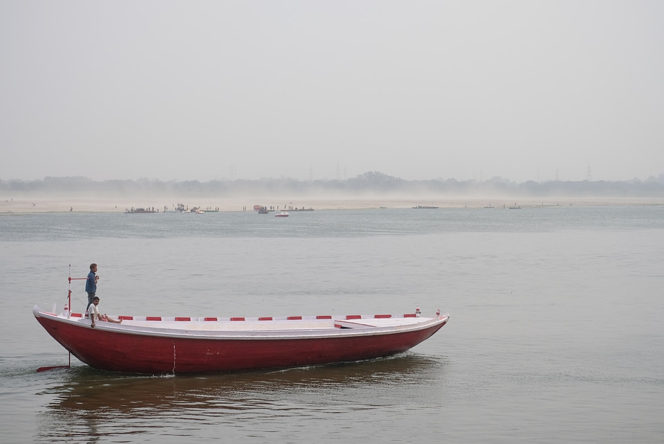 Two Men in a Red Boat